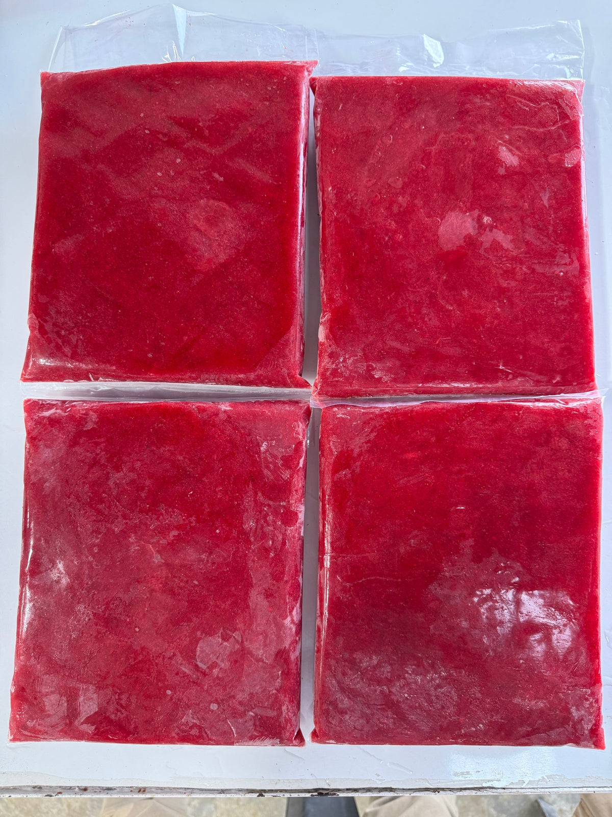 Blocks of True Berry frozen strawberry pulp